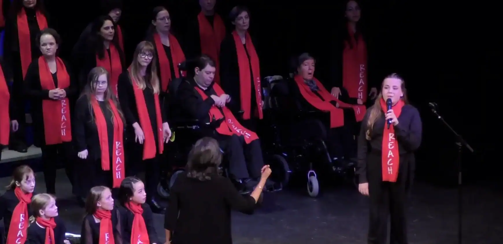 Paul performing with his R.E.A.C.H. choir